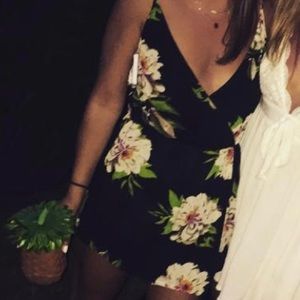 Black romper with floral detail